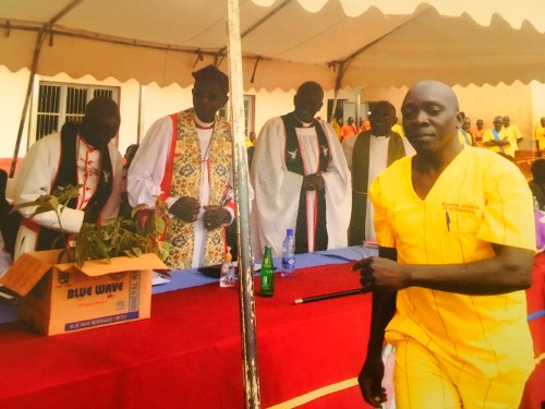 Jonathan Mugerwa after handing over seedlings to His Grace Bishop Stanley Ntagali of Church of Uganda ; Luzira Maximum Prisons 2016