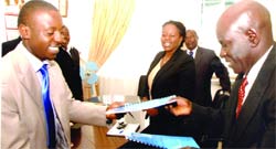 Mubiru (Right) and Dr. Maalanti exchange the MoU's